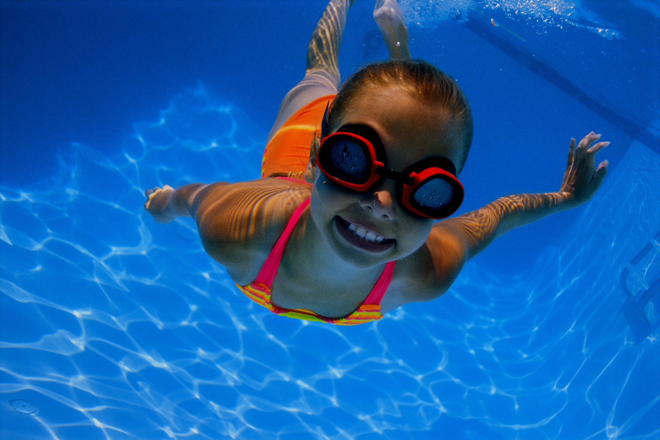 Girl swimming underwater