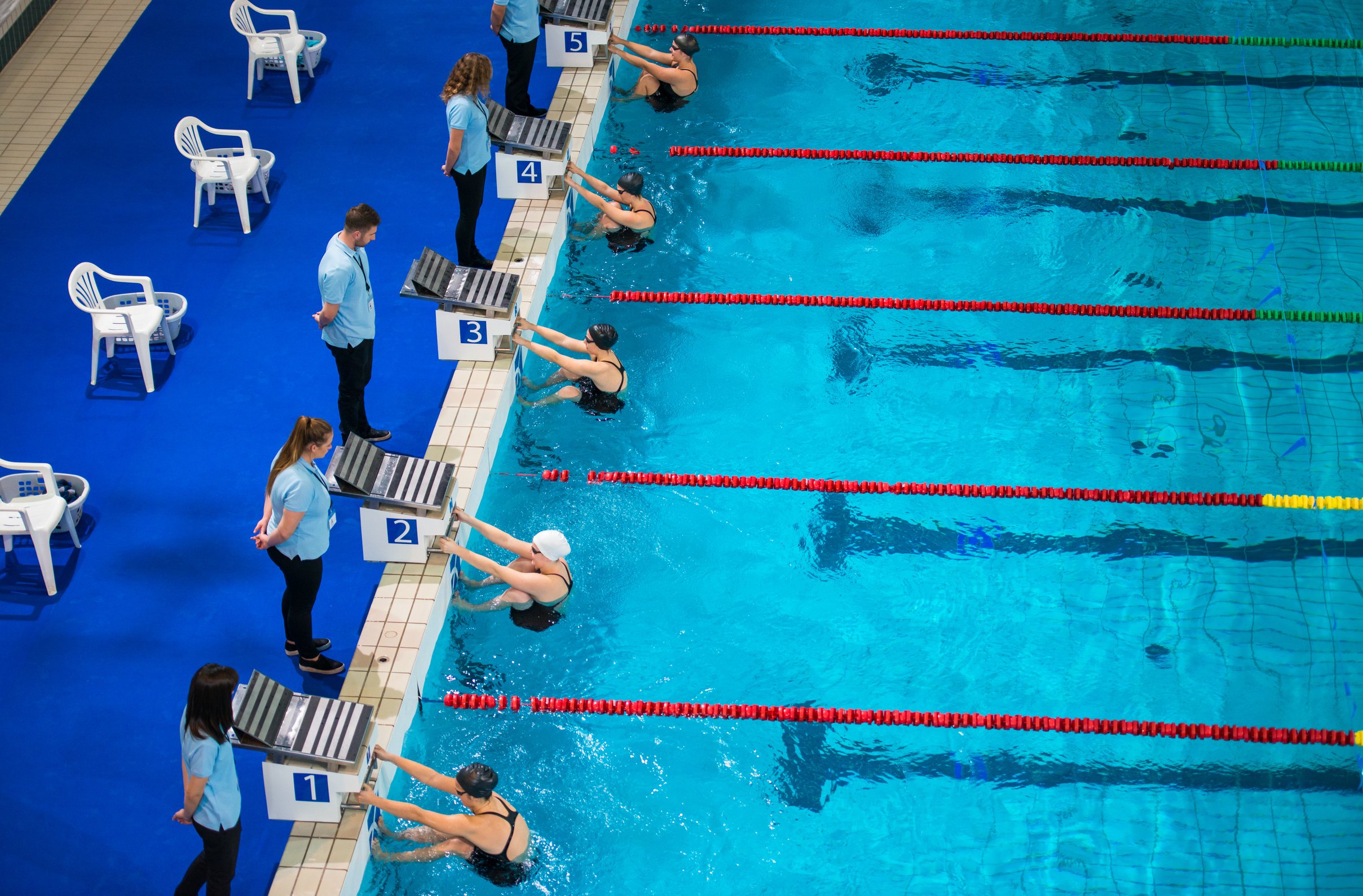 Coach Watching Swimming Competition