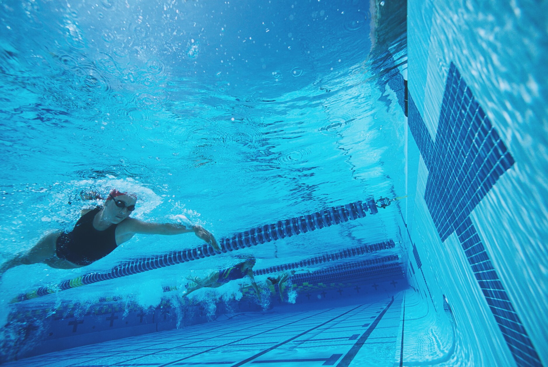 Underwater view of swimmers in pool