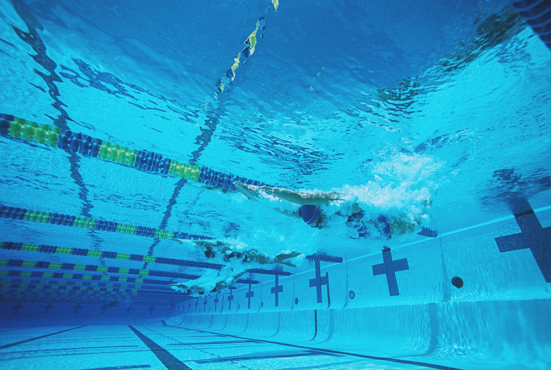 Underwater view of swimmers in pool