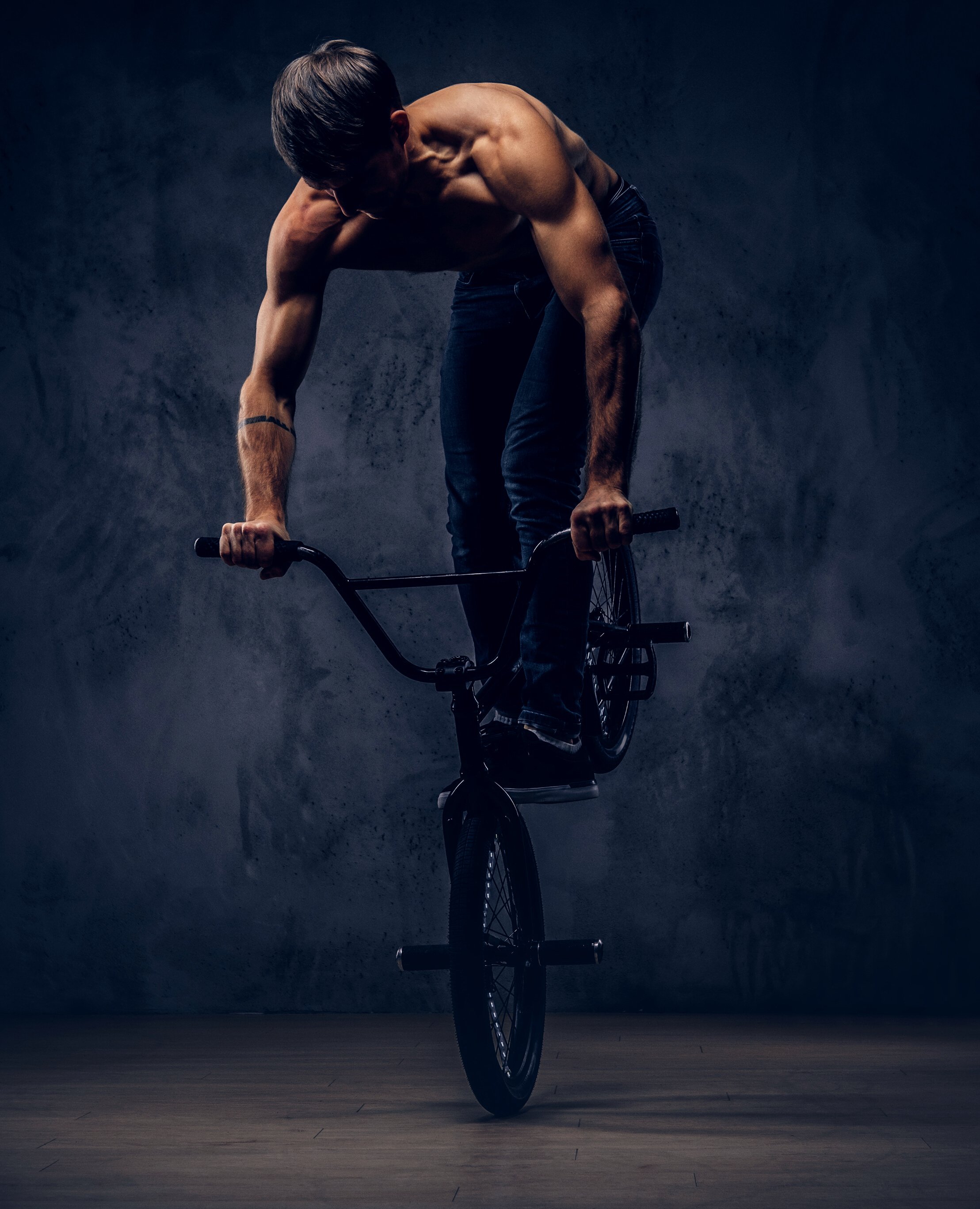 Handsome Man with BMX in a Studio